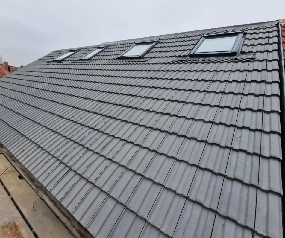 Grey tiled roof with skylights